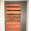 Custom steel frame door with wood slats, private residence
