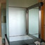 Pivoting bathroom mirror frame, private residence